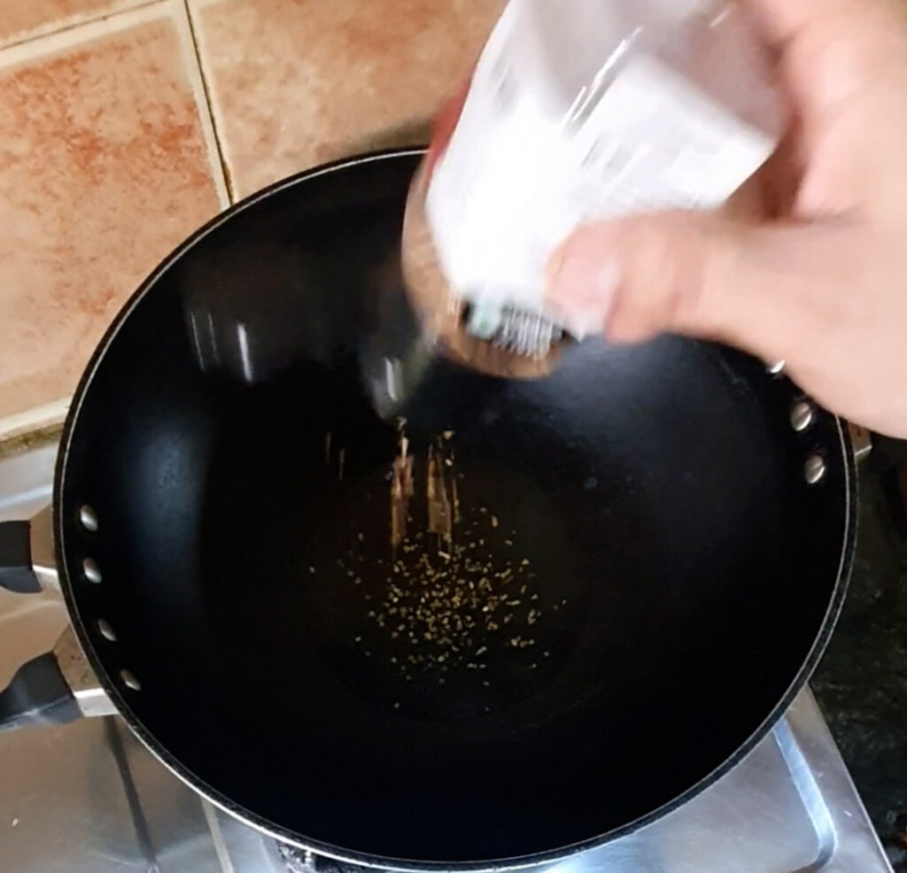 garlic granules in olive oil in a pan