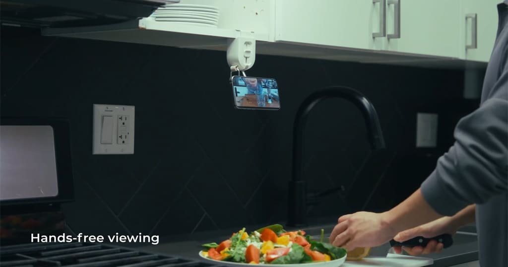 Phone holder for airplane tray table